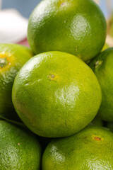 Fresh Green Limes Close-up - Citrus Fruit with Natural Shine and Tangerine Scent