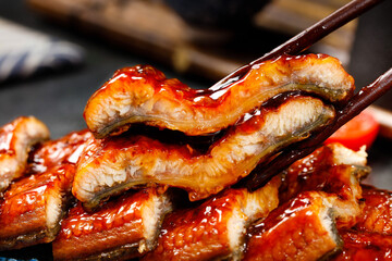 Grilled Eel with Sweet Glaze - Traditional Japanese Unagi Cuisine with Chopsticks