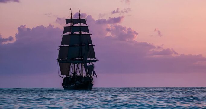 Gentle breeze catching sails, sailing multi-masted ship gliding closer across sea under sunset sky - Powered by Adobe