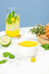 Refreshing Pineapple Cocktail with Mint and Tropical Garnish on Marble Background