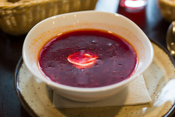 beetroot soup with sour cream in bowl