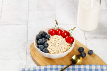 Healthy Oatmeal Bowl with Fresh Berries and Yogurt for Weight Loss Breakfast