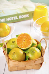Fresh Orange Citrus Fruits in Wicker Basket - Healthy Summer Vitamin C Nutrition Food Photography