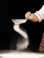 Chef Sifting Wheat Flour Through Strainer for Baking - Professional Kitchen Food Preparation