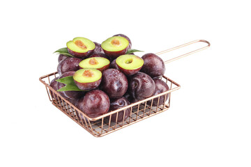 Fresh Purple Plums in Copper Basket on White Background - Healthy Organic Stone Fruit Display