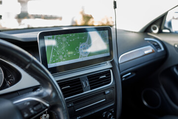 Obraz premium Modern Vehicle Cockpit with Car Keys in Ignition, Steering Wheel and Multimedia Display on Dashboard