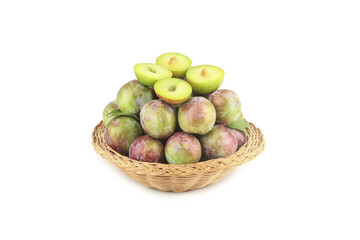 Fresh Ripe Plums in Wicker Basket on White Background with Cut Halves Showing Green Flesh