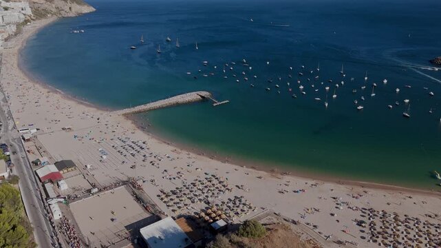 Aerial Rise Up Shot of Sesimbra Praia do Ouro, Sandy Beach and Anchored Boats