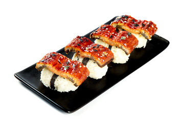 Grilled Eel Sushi Rolls with Teriyaki Glaze on Black Plate White Background