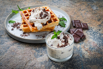 Fresh baked homemade Belgian  Brussels waffles with mascarpone cream fresh and dark chocolate...