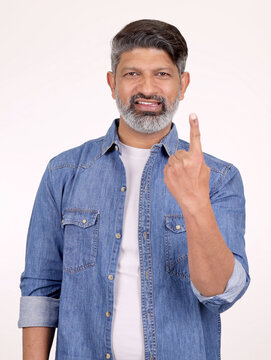 Portrait of a Indian man voter showing finger on studio white background