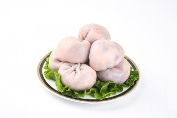 Raw Pork Belly Cuts on Plate with Lettuce Garnish Isolated on White Background