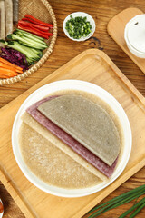 Whole Grain Buckwheat Pancakes with Meat Filling and Fresh Vegetables on Wooden Board
