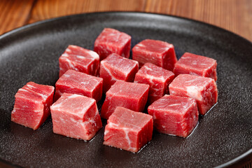 Fresh Raw Beef Cubes Diced on Black Pan - Premium Quality Meat for Cooking