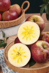 Fresh Cut Red Apples Showing Star Core Pattern on Wooden Board