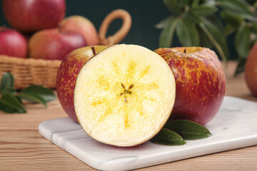 Freshly Cut Apples on Marble Board with Whole Fruits in Wicker Basket Kitchen Still Life