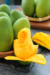 Fresh Green Mangoes with Orange Flesh on Wooden Board - Tropical Fruit Display