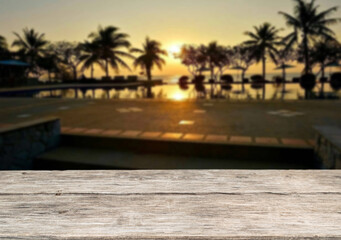 Wooden table top on the beach or sea.Party on the beach  sunset time concept.For montage product display or design key visual layout.View of copy space.