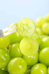 Fresh Green Grapes with Fork - Healthy Fruit Snack in Natural Sunshine Light