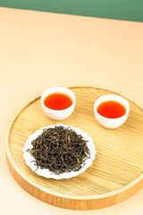Longjing Green Tea Leaves and Brewed Tea on Wooden Tray - Premium Mountain Plantation Harvest