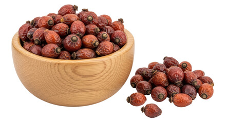 Isolated Rose hips in wooden bowl and pile, medicinal autumn fruit for herbal infusion