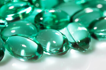 Blue green pill capsules isolated, analgesic pile, painkiller drugs, sedative pills