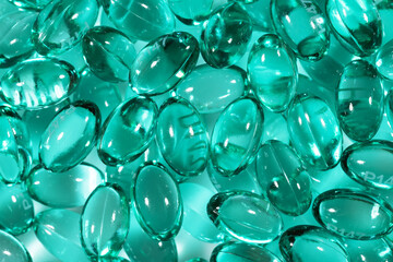 Blue capsules in the shell with liquid vitamin. Blue capsules with a dietary supplement for joints teeth and bones