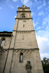 Fototapeta premium Close-up view of Grossmünster twin towers in Zürich, Switzerland, rising against a clear blue sky