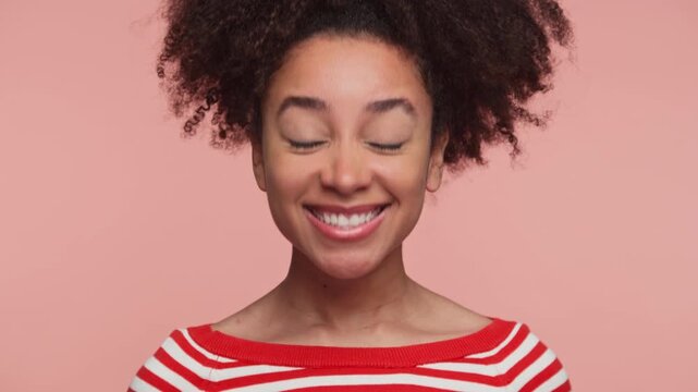 Smiling woman nodding head in approval