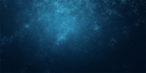 An abstract blue background with light rays piercing through a texture of dark smoke and clouds