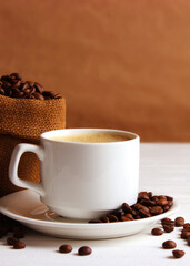 Cup of aromatic coffee and coffee beans on a wooden background.. Vertical photo format