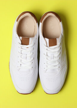 men's sneakers on a colored background top view. men's footwear. minimalism. Vertical photo format