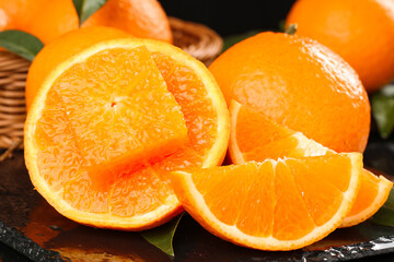 Fresh Orange Citrus Fruit Sliced in Half Showing Juicy Segments in Wicker Basket