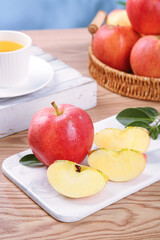 Fresh Red Fuji Apples from Xinjiang Aksu - Whole and Sliced Fruit on Kitchen Table