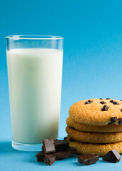 Delicious cookies with chocolate chips on a colored background. Vertical photo format