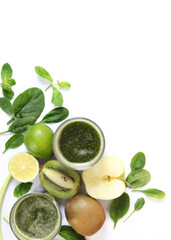 Green smoothie and fresh vegetables on the table for the detox organism. Vertical photo format