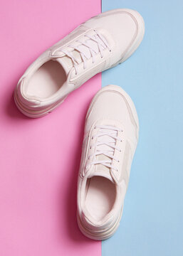 women's sneakers on a colored background top view. Women's shoes.. Vertical photo format