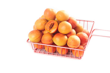 Fresh Small Red Apricots from Xinjiang in Wire Basket Isolated on White Background