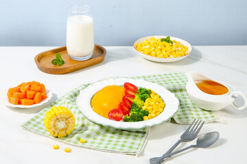 Fresh corn kernel salad with vegetables and milk - healthy cuisine meal setup on white table