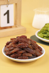 Xinjiang Raisins in Bowl - Healthy Dried Fruit Snack on Wooden Table