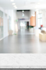 Empty white marble table over blur office background,  Vertical stone desk for product display mock up template banner, white background