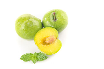 Fresh Sichuan Plums with Water Droplets on White Background - Organic Stone Fruit Display
