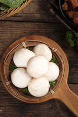 Fresh White Button Mushrooms in Wooden Basket with Vegetables on Rustic Wood Table Studio Shot