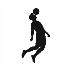 Silhouette of a soccer player heading the ball