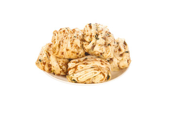 Handmade herbed pasta rolls on white background for Italian cooking