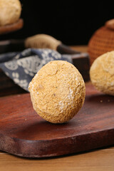 Whole coconut with natural shell on wooden board tropical cooking ingredient