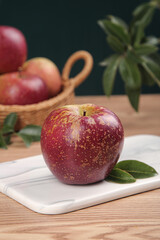 Fresh Red Apple with Golden Speckles on Cutting Board - Healthy Organic Fruit Kitchen Still Life