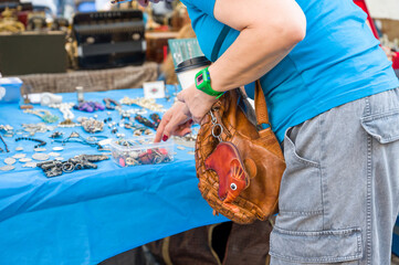 A person looking for some deals in a flea market