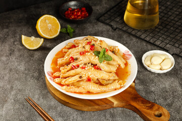 Spicy Pickled Chicken Claws Phoenix Style Asian Cuisine Delicacy Food Collection with Chili Peppers and Lemon