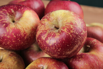Fresh Daliangshan Apples with Heart-Shaped Natural Markings and Rustic Red Yellow Speckled Skin